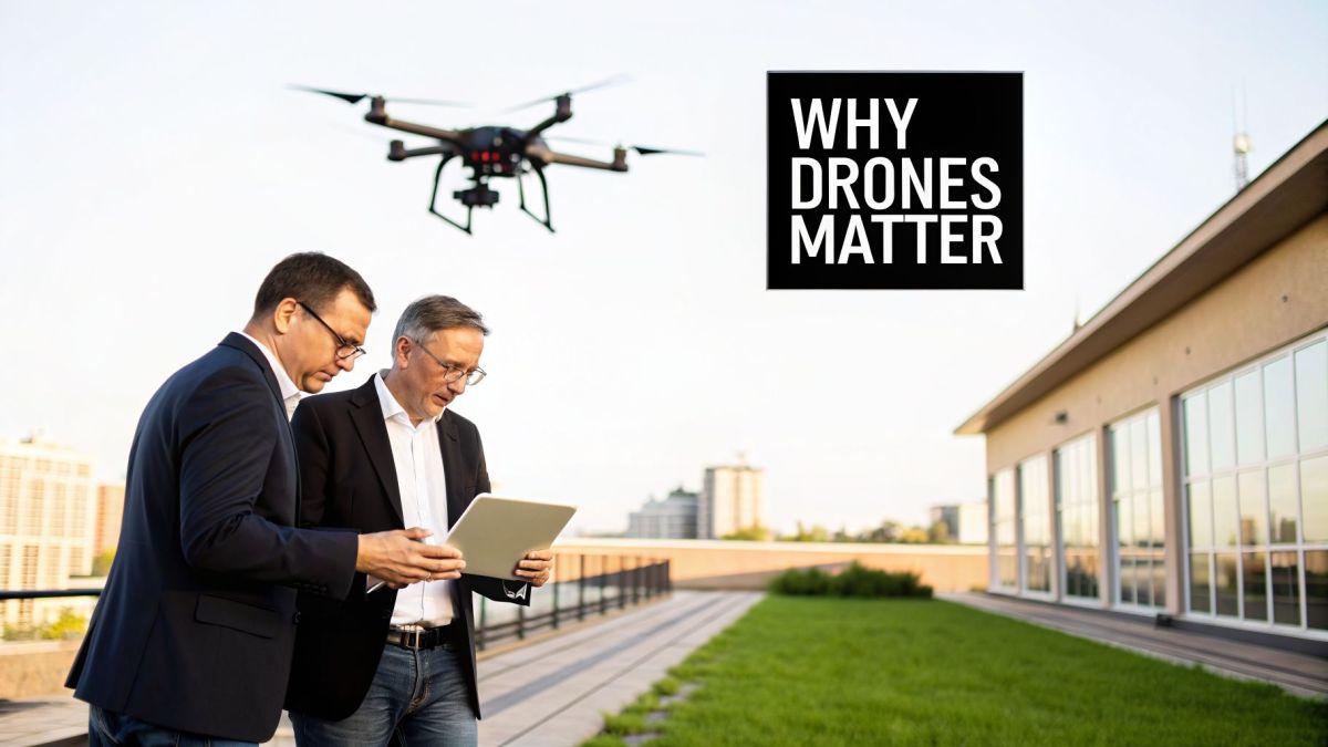 Two businessmen on a rooftop review data on a tablet while a drone flies overhead, highlighting drone importance.